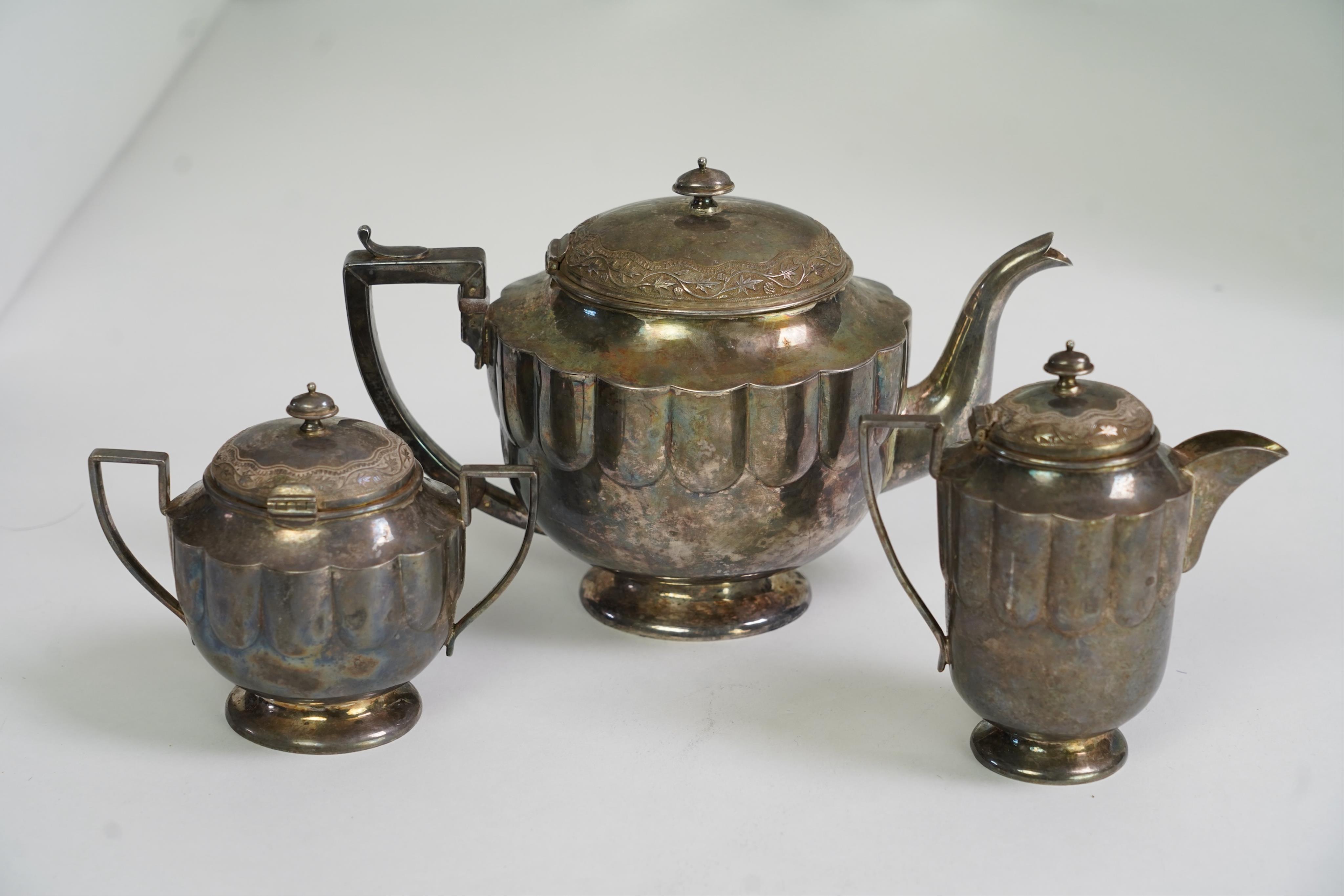 An early 20th century Indian white metal (tests as silver) three piece tea set